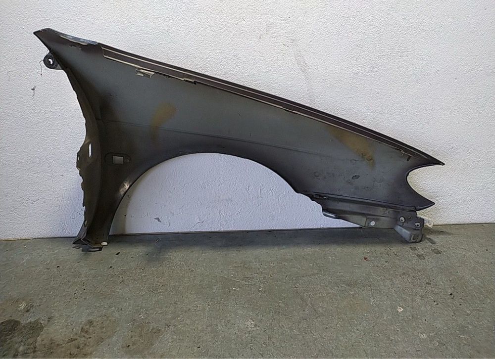 Guarda lamas esquerdo megane coupe 1