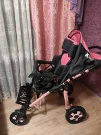 Дитяча інвалідна коляска