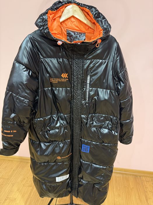 Жіночий подовжений пуховик