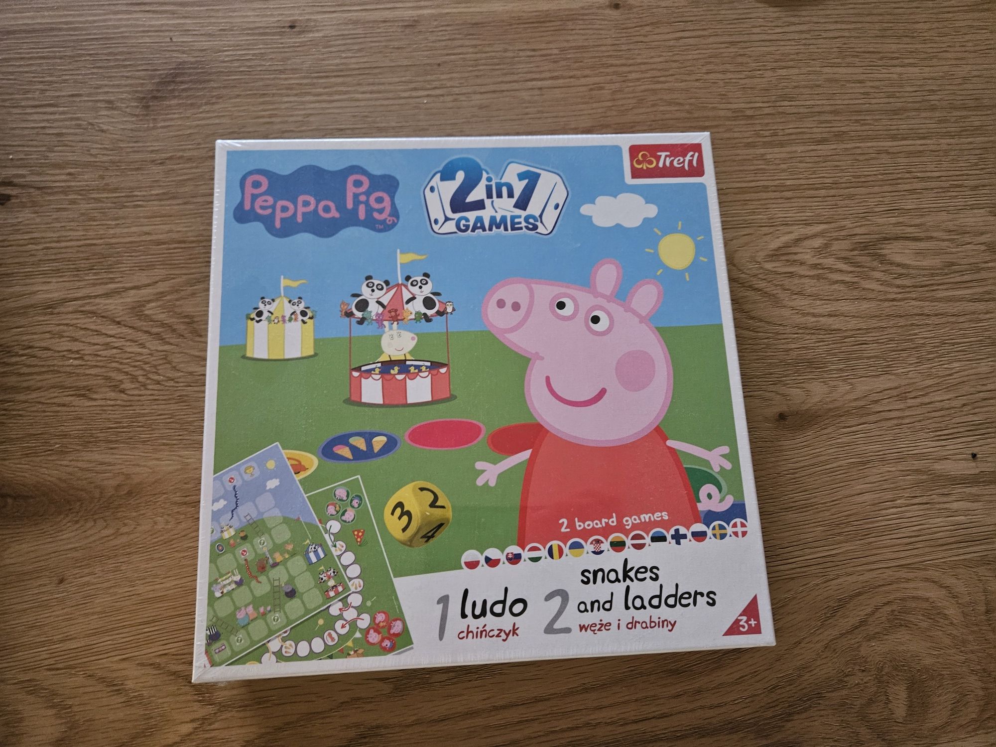 NOWA Ludo = Chińczyk. Snakes and ladders = Węże i drabiny. Peppa Pig
