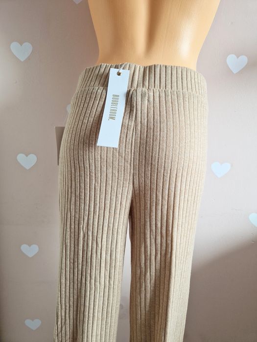 Spodnie materiałowe beżowe rozkloszowane szerokie dzwony prążkowane bu