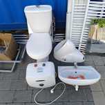 Zestaw sanitarny toaleta pisuar podgrzewacz wody umywalka