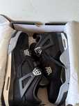 Jordan 4 “black canvas”