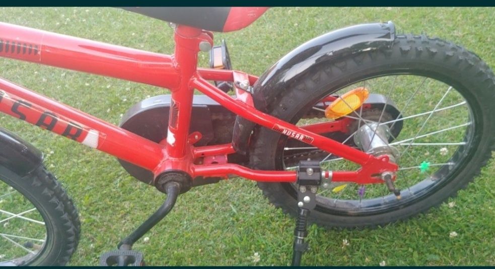 Czerwony rower Husar, koła 16, drążek, kółka boczne