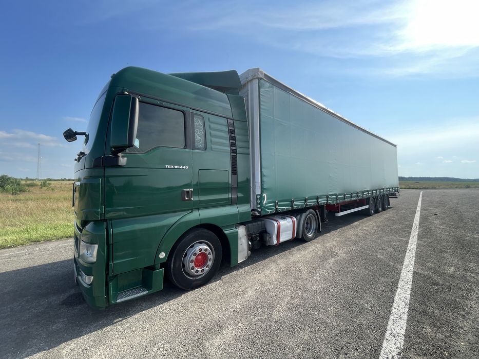 Тягач Man TGX 18.440 MEGA + напівпричіп штора Kassbohrer осі SAF