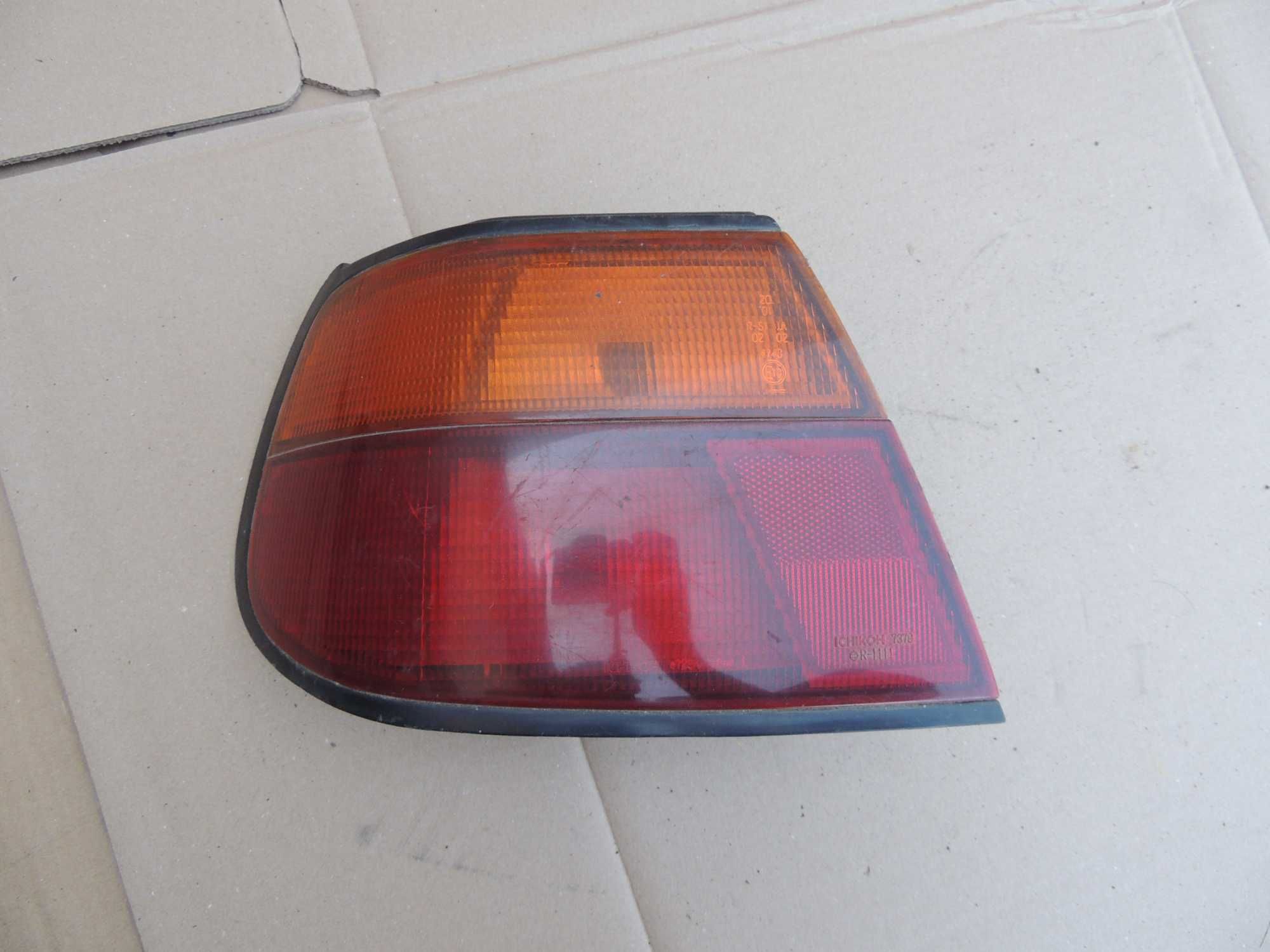 Lampa tył tylna lewa europejska Nissan Almera N15 95,96,97,98 HB