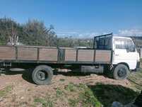 Nissan Cabstar 3500cc ligeira com caixa madeira 5Mts