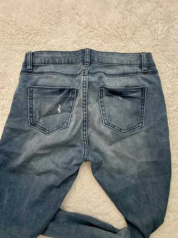Spodnie jeansy dziury Mohito 34XS