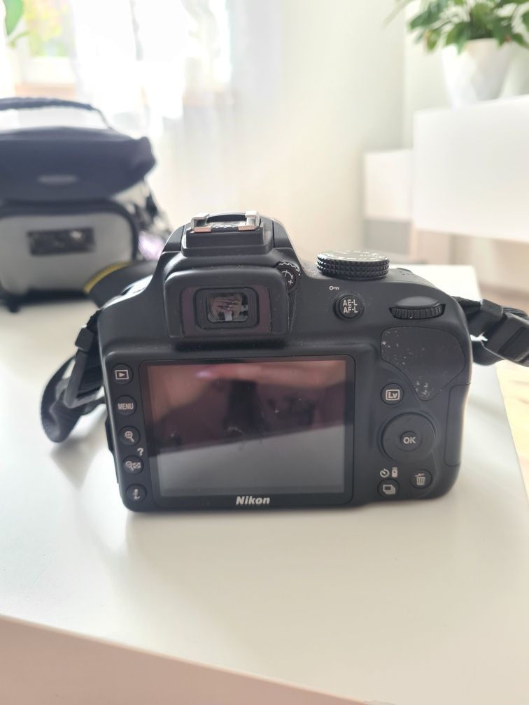 Aparat Nikon z obiektywem Tamron