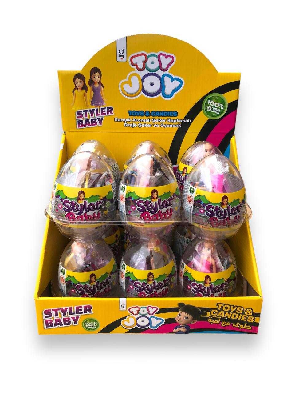 Прозоре пластикове яйце з супер іграшкою і цукровим драже.