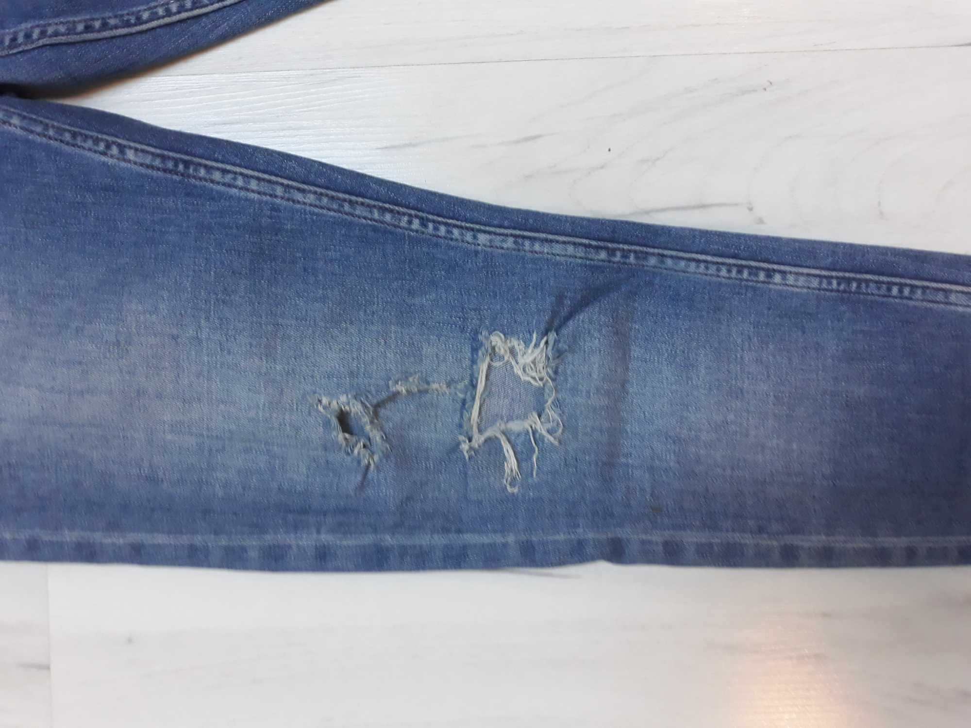 spodnie jeans top shop z dziurami