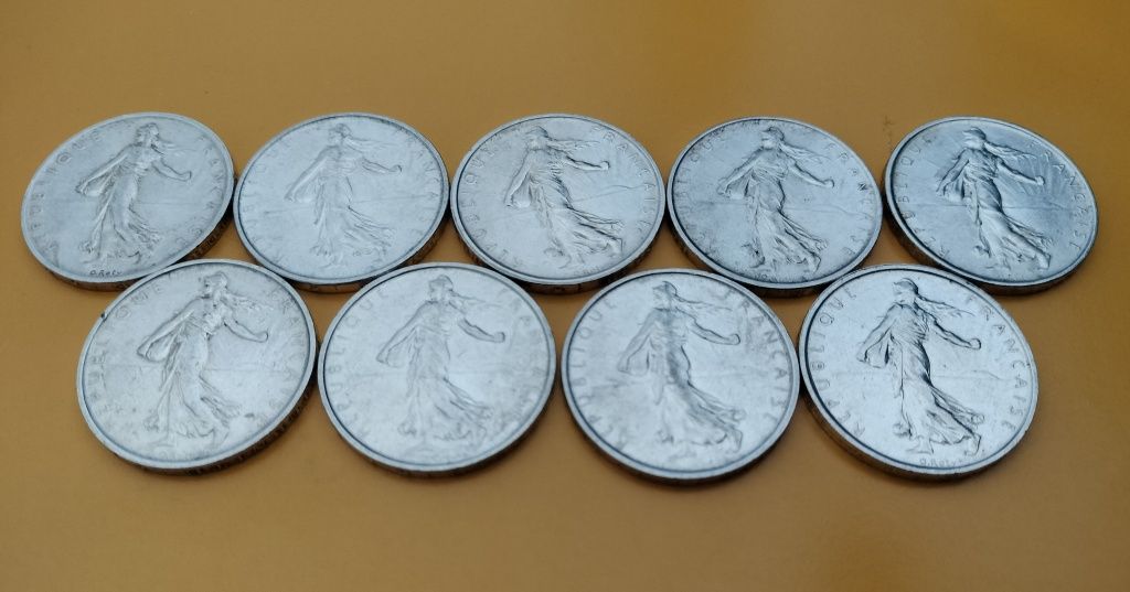 Monety srebrne franki francuskie 5 FrF- kolejne roczniki – 9 sztuk