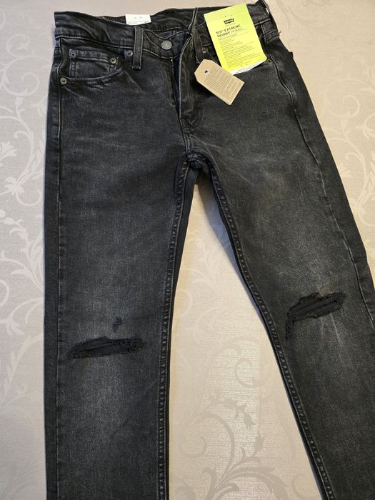 Nowe spodnie Levisy 519 unisex W29 czarne