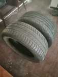 um pneu da  marca Good Year e o  outro  da marca Three-a.205\55R16
