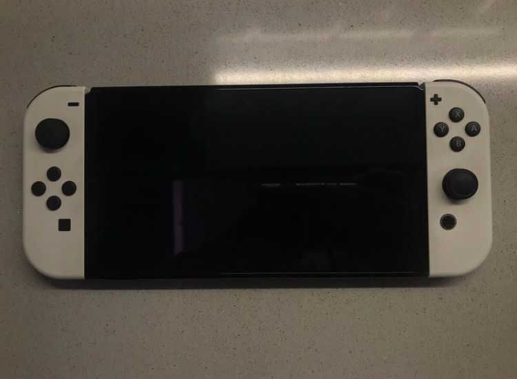 Nintendo switch Oled blanco + joycon extra + estuche protector