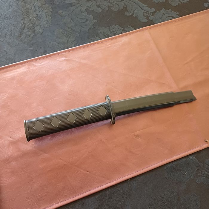Espada samurai retráctil de plastico