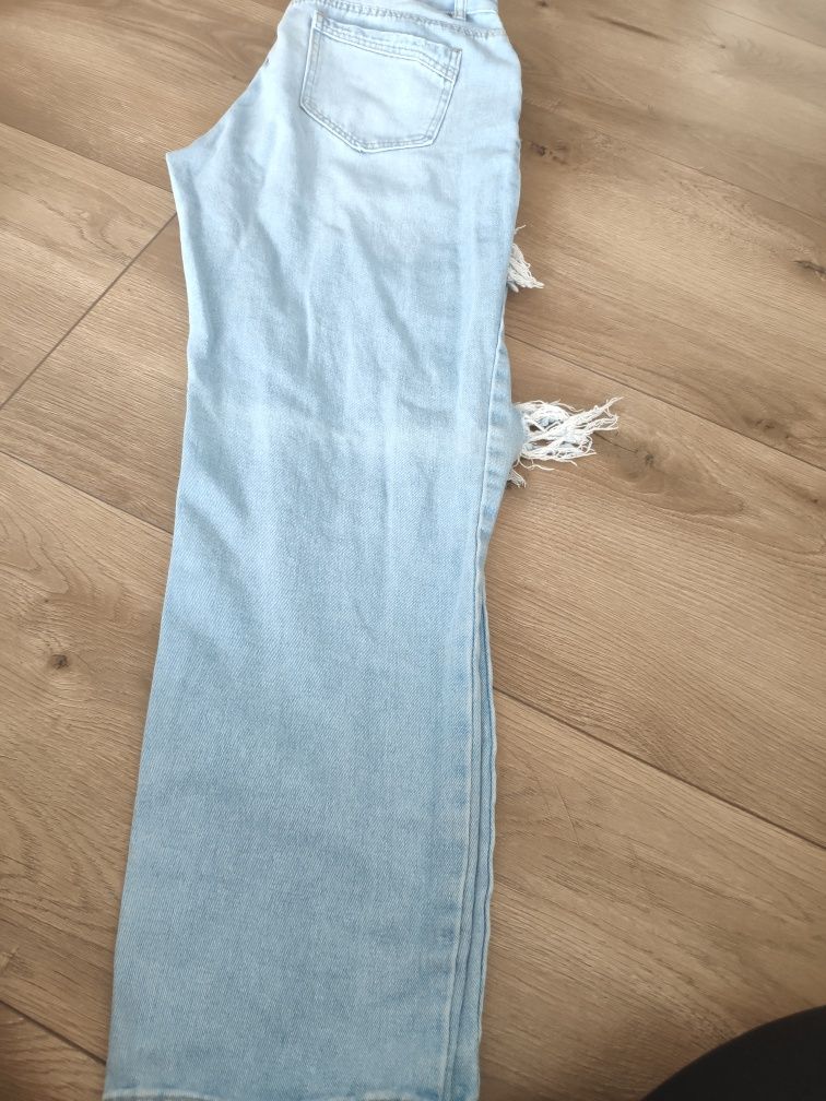 Spodnie jeans z dziurami rozmiar M