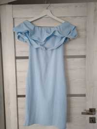 Błękitna sukienka z falbaną