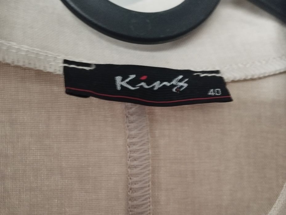 Piękna jasna narzutka damska