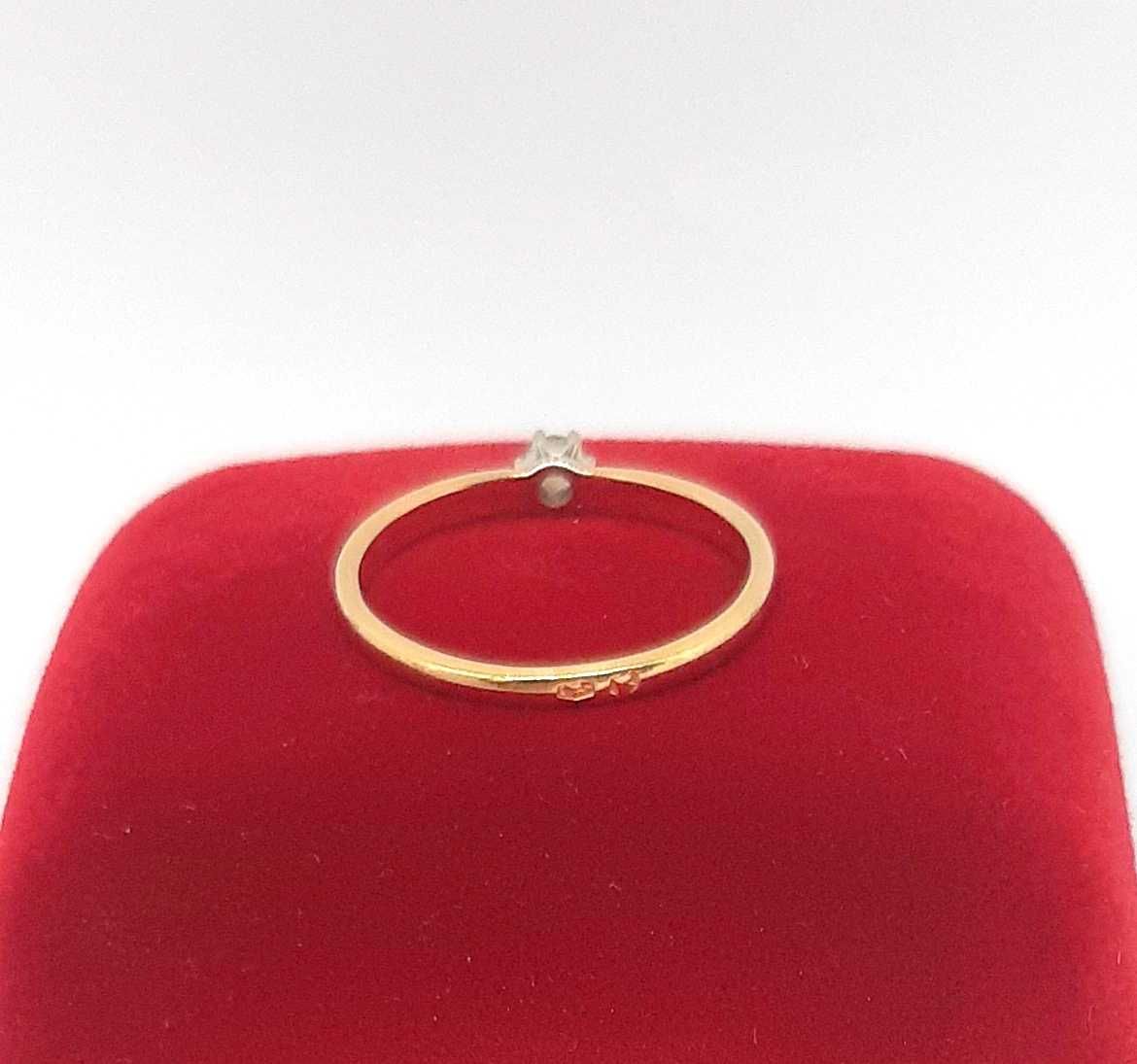 Złoty pierścionek z Brylantem 0,08ct PR.585 W:1,51gr R.12 ,