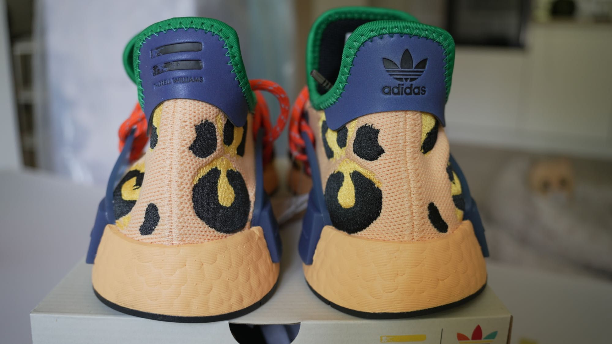 Adidas
x Pharrell HU NMD Animal Print "Amber" sneakers