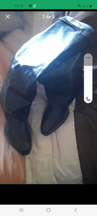 Botas pretas cano alto