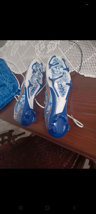 Chuteiras CR7 Pitons FG