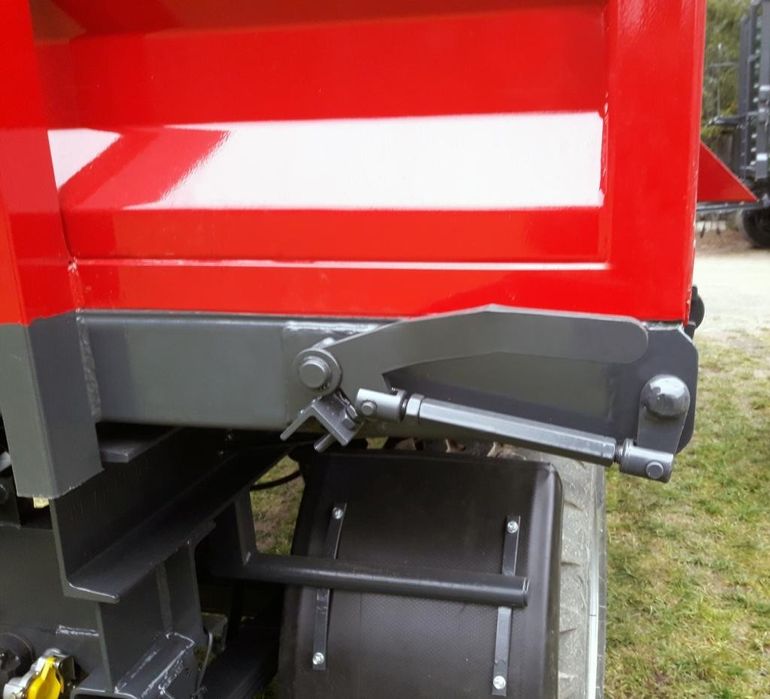 Dźwignia dolnego otwierania burty wysyp - LEWA (do pręta Fi22)