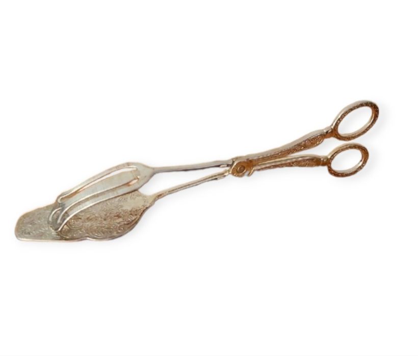 Щипцы  посеребренные для выпечки .