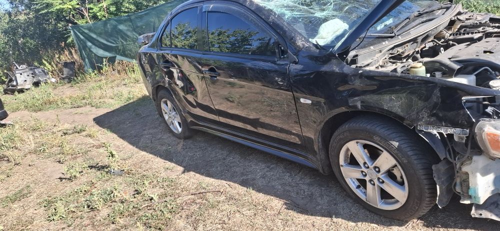 Разборка Mitsubishi LancerХ  10  2 литра  вариатор  пробег 100 тис км.