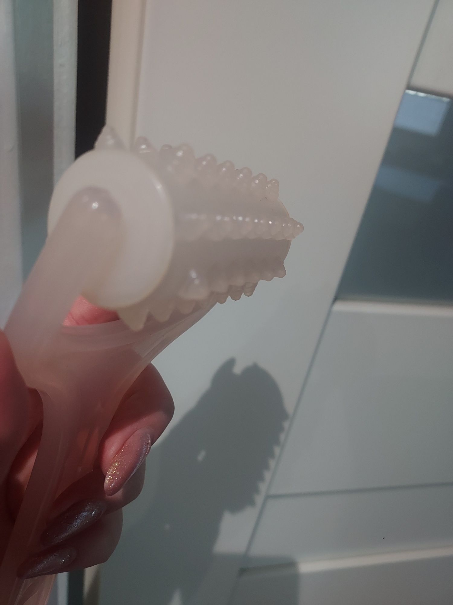 Masażer do ciała ręczny z obracaną nakładką z kolcami