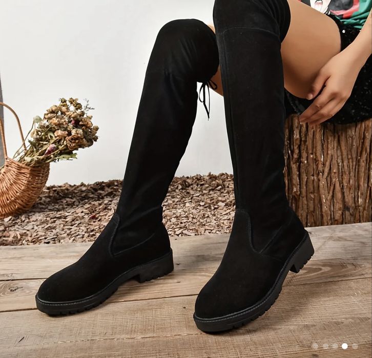 Стильні жіночі чоботи вище колін