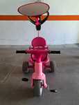 Triciclo rosa criança