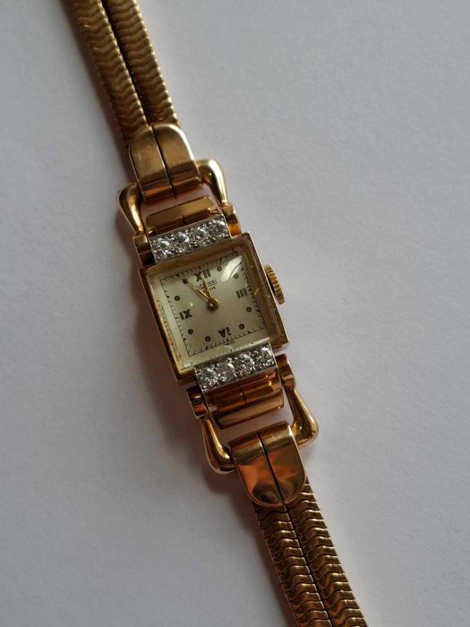 Relógio de corda todo em ouro e diamantes