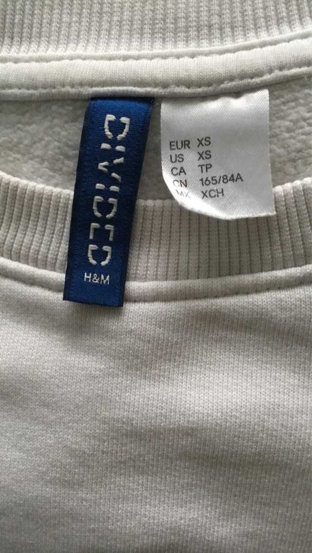 Bluza w kolorze białym. H&M.
