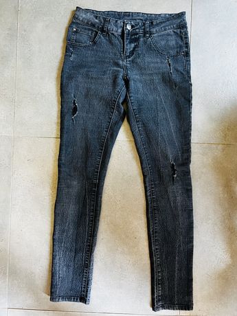 Modne spodnie/ jeansy z przetarciami Esmara, 38