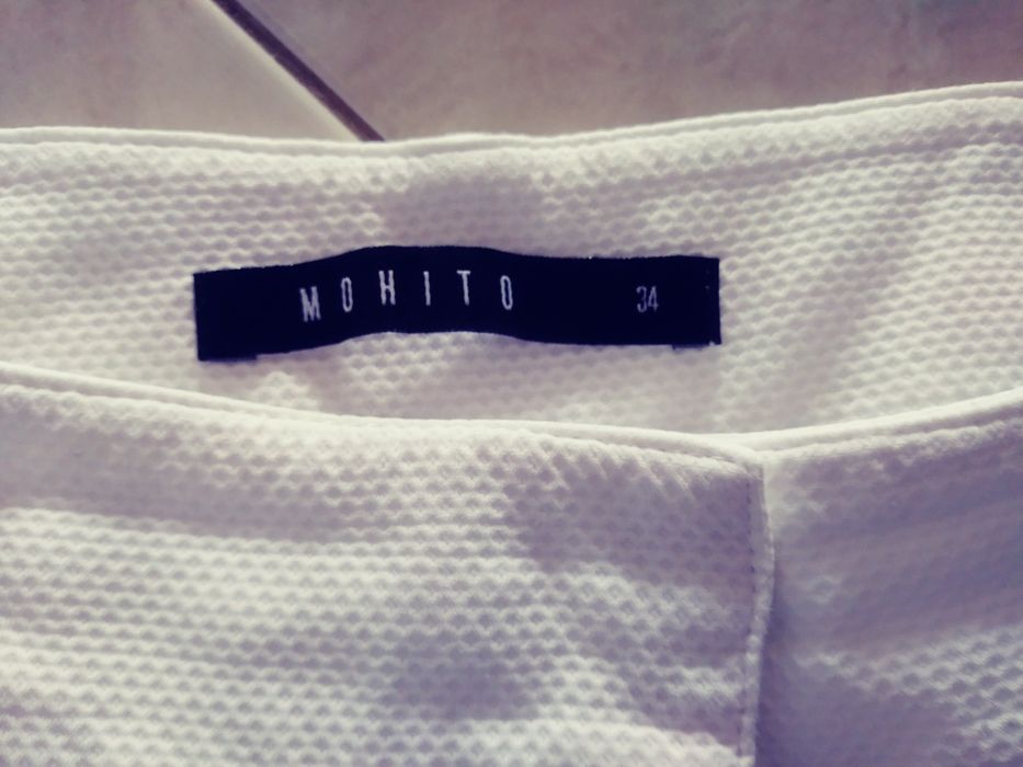 Białe spodnie Mohito roz 34