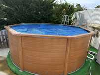 Piscina de superficie redonda em aço gre, estilo madeira