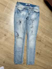 Spodnie jeansowe z dziurami damskie r S