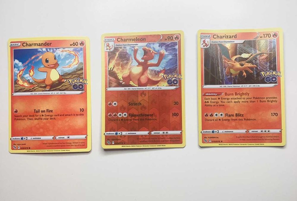 Cartas Pokemon Go Evoluções Charizard Tyranitar Treinadores e outros