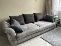 Rozkładana szara sofa z pojemnikiem