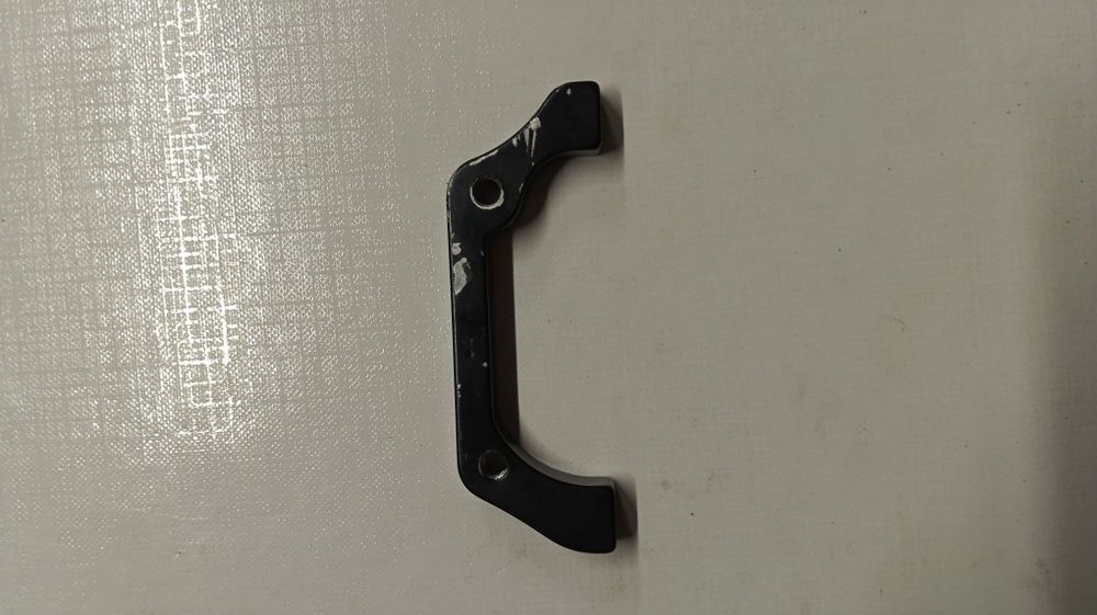 Adapter hamulca tarczowego 160/180mm