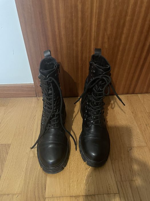 Botas Exê todas em pele
