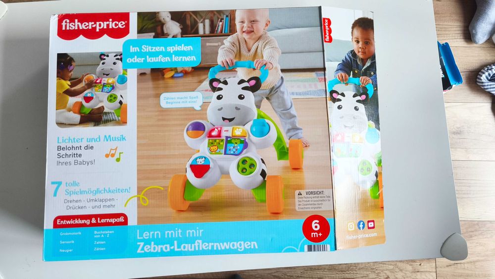 Interaktywny pchacz Zebra Fisher-Price wersja niemiecka chodzik