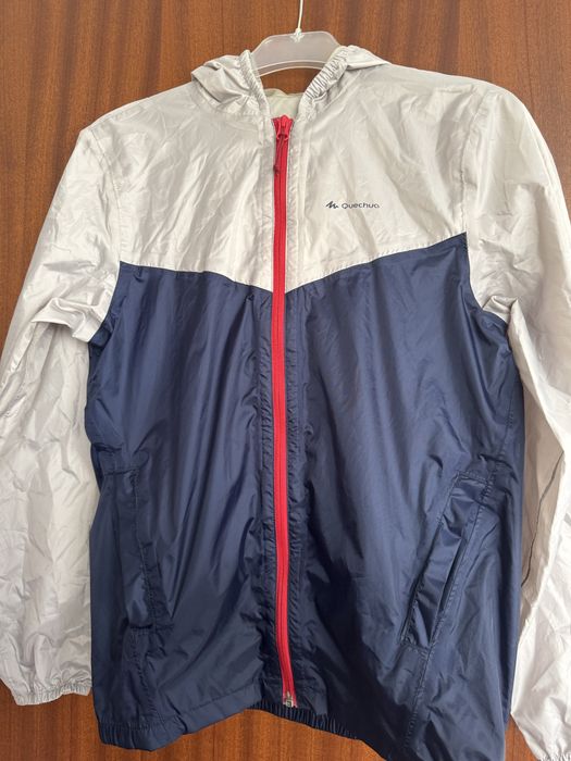 Corta vento com bolsa