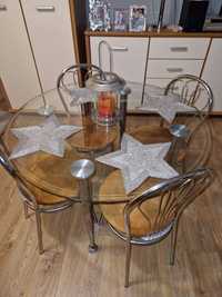 Szklany , okrągły stół z tapicerowanymi krzesłami