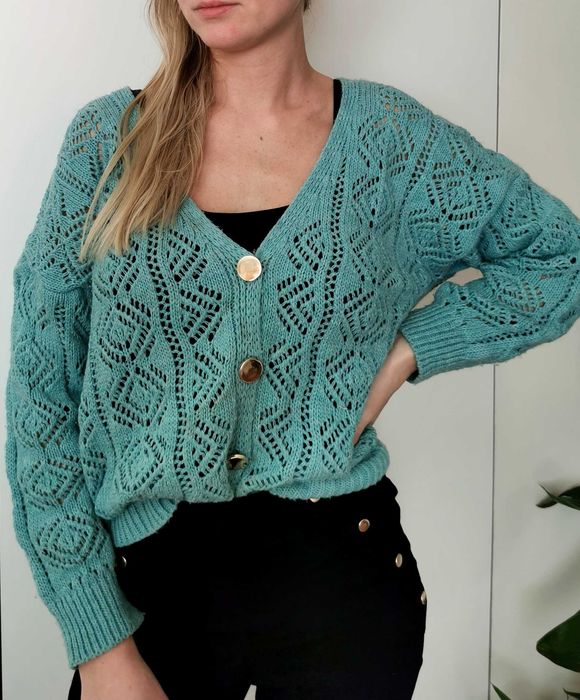 Seledynowy ażurowy sweter