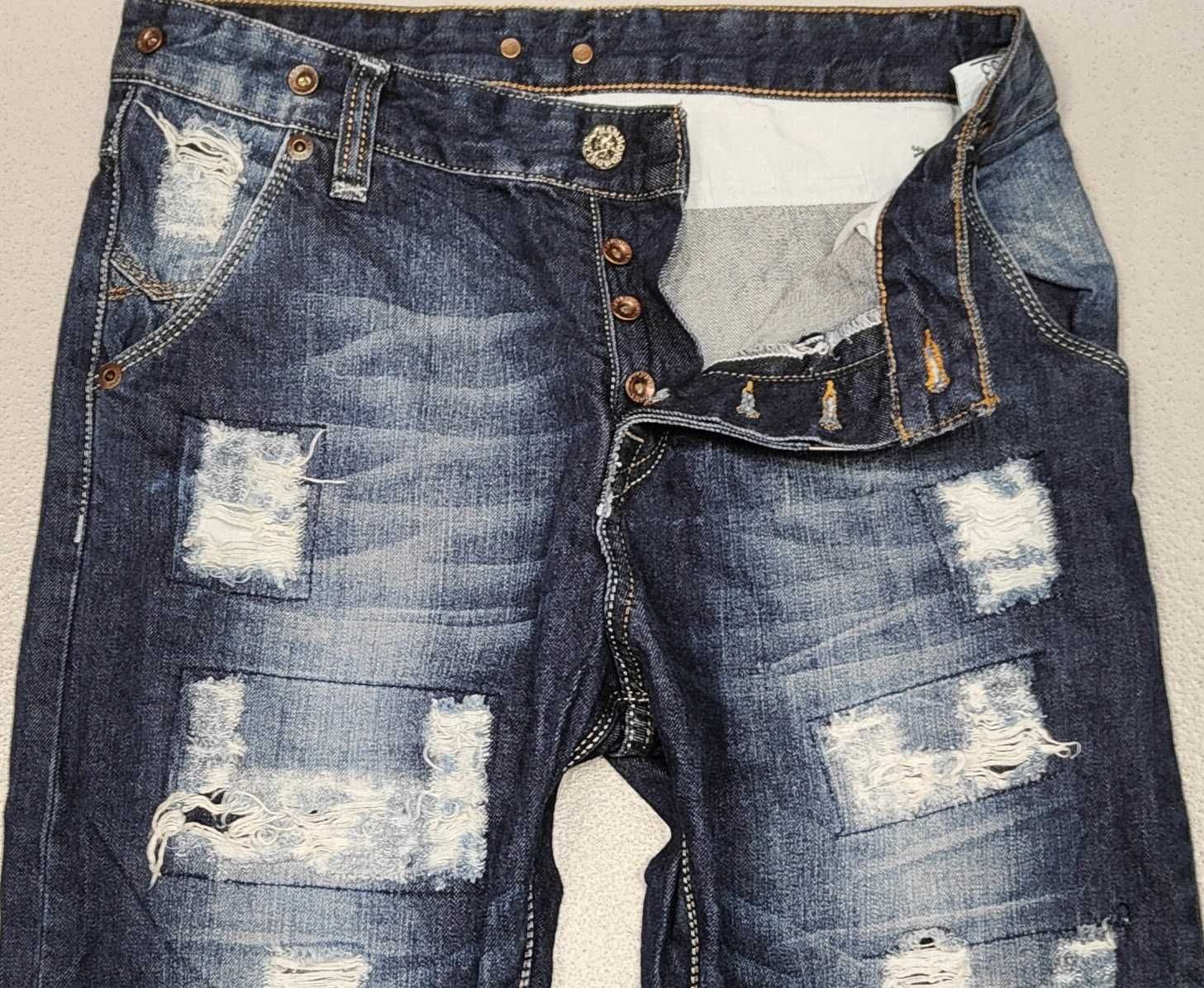 R) ADRIAN HAMMOND męskie spodnie jeansowe z dziurami Roz.33