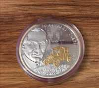 Moneta srebrna z pozłacanym detalem