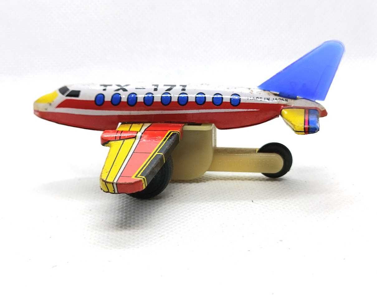 Avião brinquedo antigo em lata de fricção TX 171